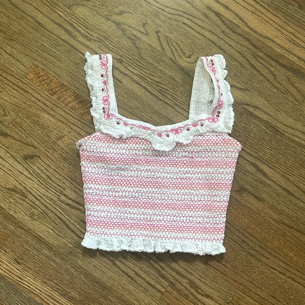LoveShackFancy medium white smocked top with pink and red accents/cherries